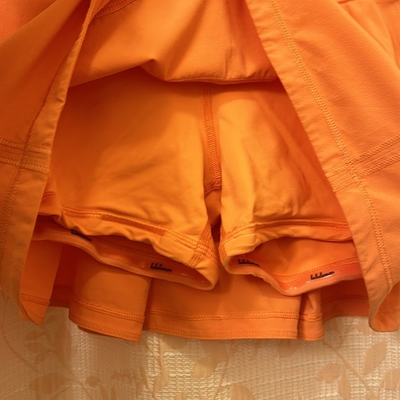 Lululemon pace rival skirt. Amazing condition. Size 4. Salmon/light orange pink - Picture 3 of 7